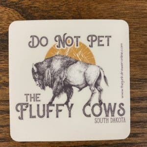 Do Not Pet the Fluffy Cows South Dakota sticker with a buffalo with the sun and hills being it design