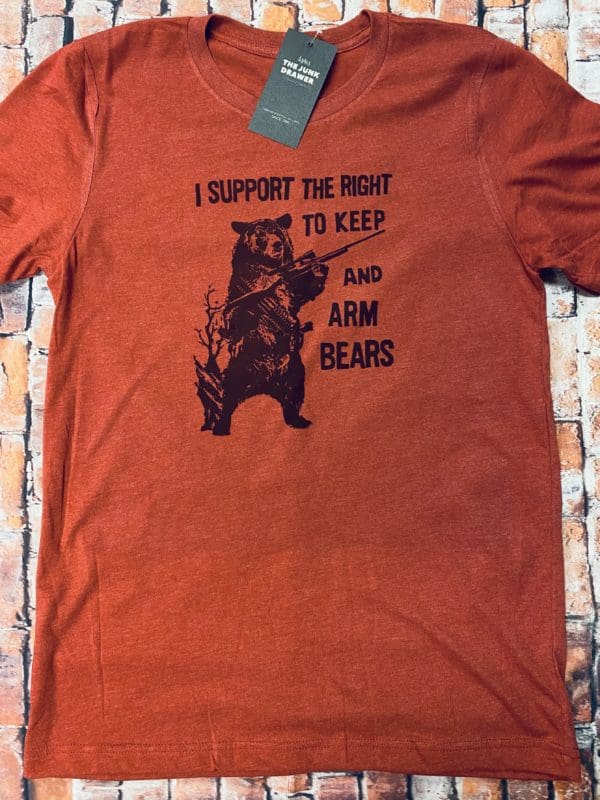 Full view of the I support the right to keep and arm bears text above a bear holding a rifle with an ammo sash