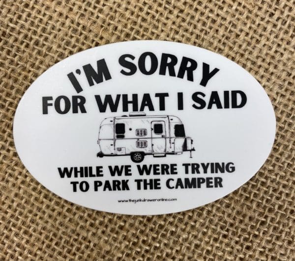 I'm Sorry for what I said text above an image of a airstream camper with while we were trying to park the camper text below on an oval sticker.