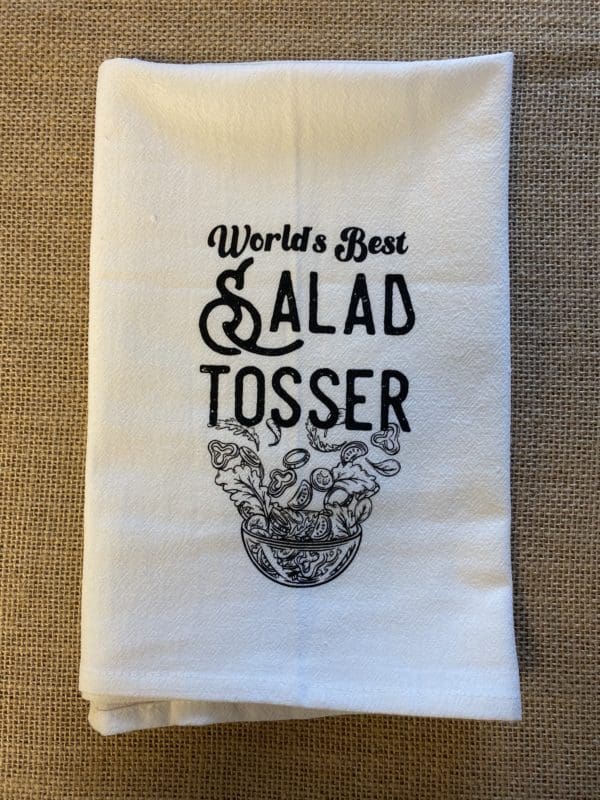 Worlds best salad tosser text above a salad being tossed in a bowl