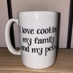 Custom mug with I love cooking my family and pets. text