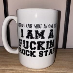 Custom mug with I don't care what anyone says I'm a fuckin' rock star text
