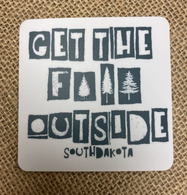 Get the F Outside stylized text with trees censoring the swear word above South Dakota text on a sticker.
