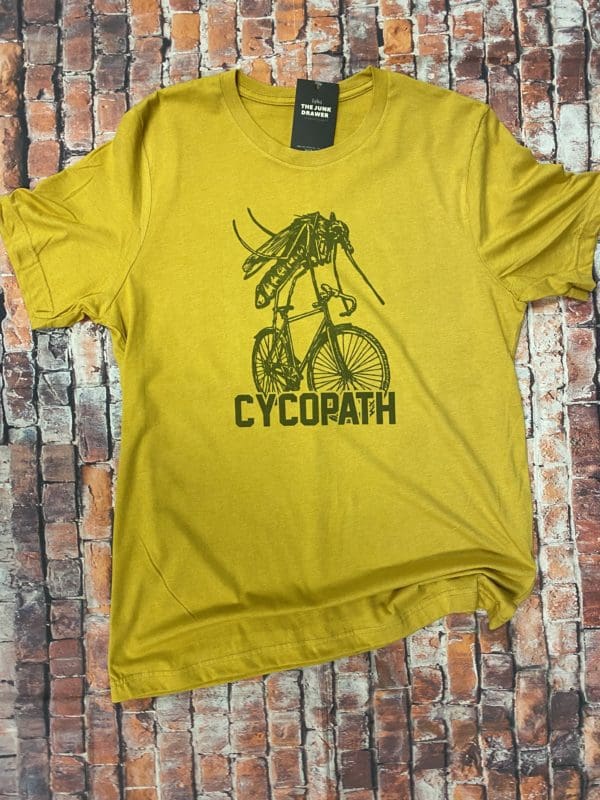 T-shirt with a mosquito riding a bicycle with cycopath text below it