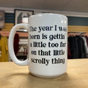 YEAR I WAS BORN IS A LITTLE TOO FAR CERAMIC MUG