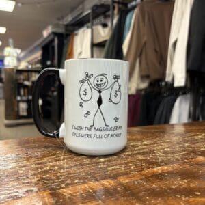 EYE BAGS FULL OF MONEY CERAMIC MUG